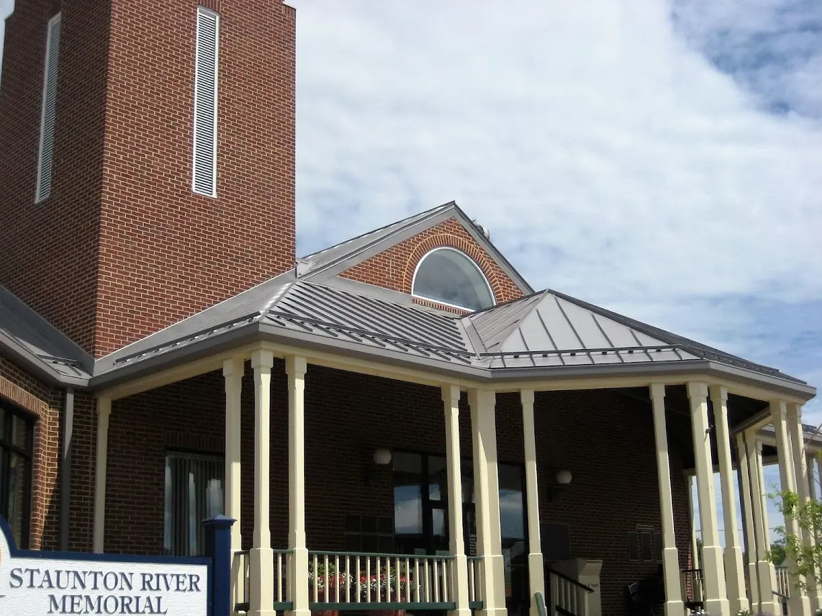 Skilled roofing craftsmen working on a residential roof in Bay City